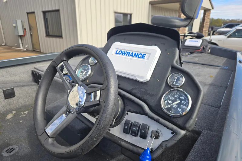 Slide: The Image of 2023 Ranger RT188P boat dashboard with steering wheel and Lowrance Elite fish finder. - 12