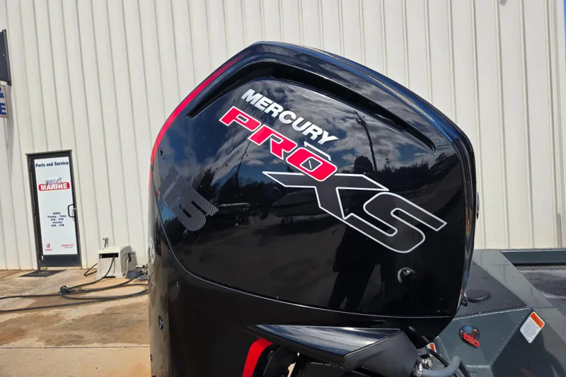 Slide: The Image of 2023 Ranger RT188P with Mercury Pro XS engine at a marine service center. - 14