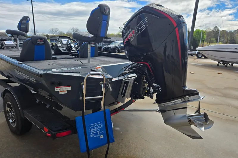 Slide: The Image of 2023 Ranger RT188P boat with powerful outboard motor and seating, displayed outdoors. - 3