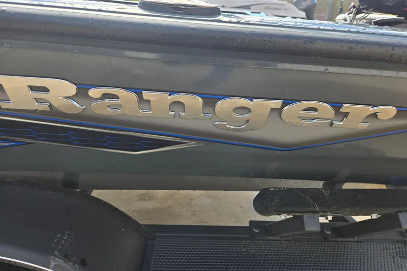 Slide: The Image of 2023 Ranger RT188P boat with metallic logo and sleek design details. - 7