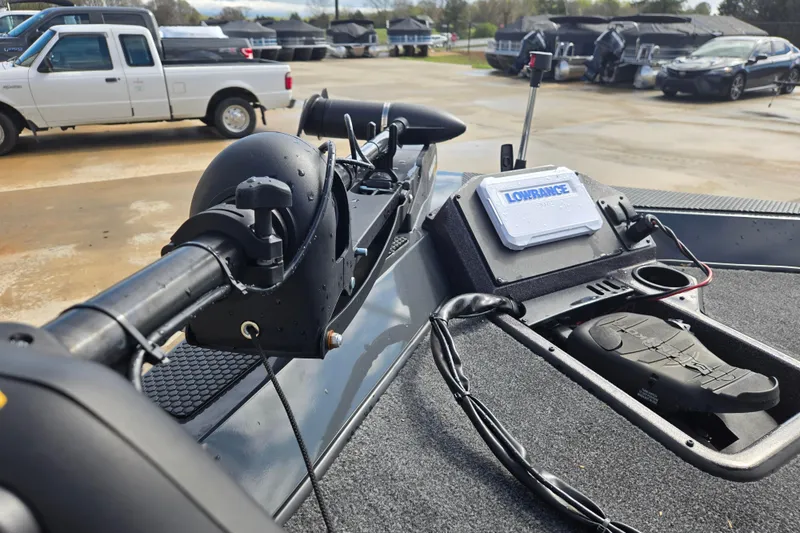 Slide: The Image of 2023 Ranger RT188P boat with Lowrance electronics and trolling motor in a parking lot. - 8