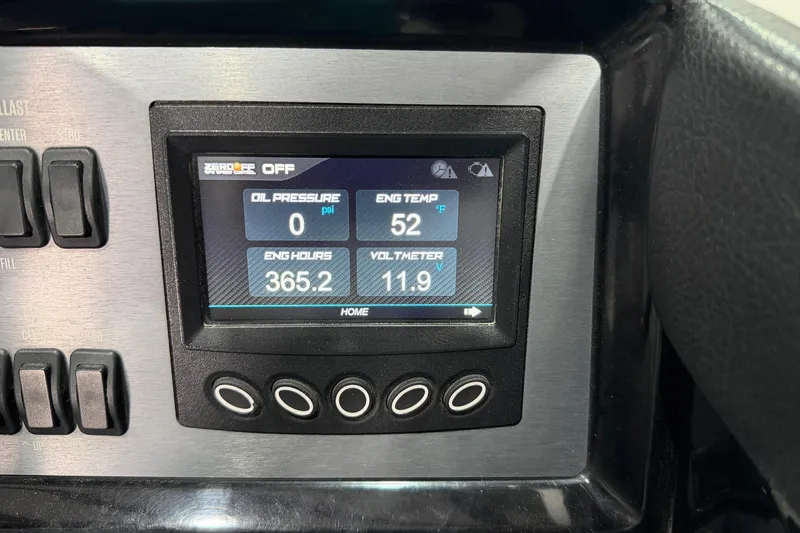 Slide: The Image of Dashboard display of a 2020 MasterCraft NXT22 showing engine metrics and controls. - 12