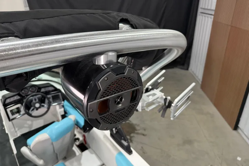 Slide: The Image of 2020 MasterCraft NXT22 boat interior with speaker and wakeboard rack. - 13