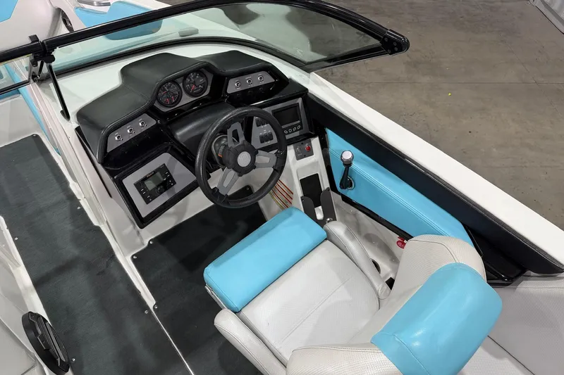 Slide: The Image of 2020 MasterCraft NXT22 boat interior with steering wheel and dashboard controls. - 7