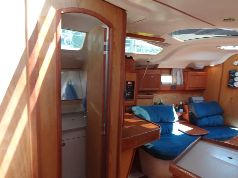 Slide: The Image of Interior of a 2001 Hunter 380 yacht with wooden furnishings. - 31