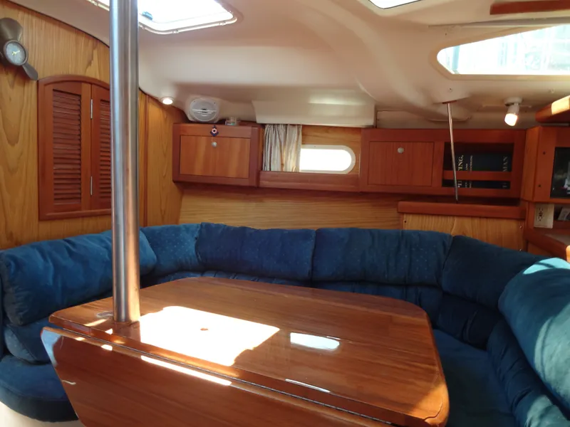 Slide: The Image of Interior of a 2001 Hunter 380 yacht with blue upholstery. - 34