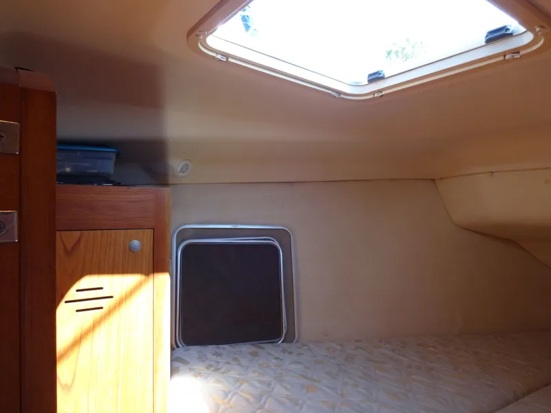 Slide: The Image of Interior of a 2001 Hunter 380 yacht with bed and cabinet. - 37