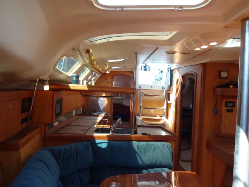 Slide: The Image of Interior of a 2001 Hunter 380 yacht with wooden furnishings. - 45