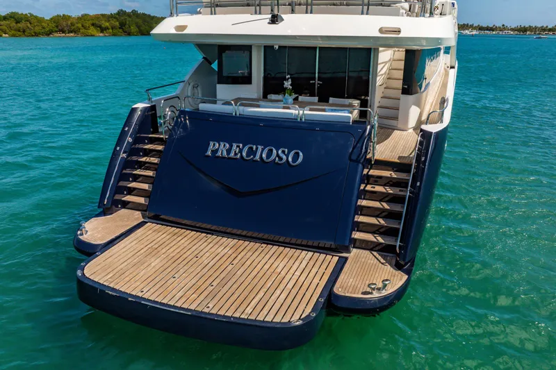 Slide: The Image of Luxurious 2011 Sunseeker 34 Metre Yacht on turquoise waters, featuring elegant deck design. - 10