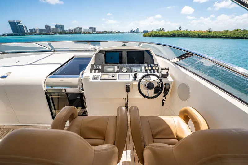 Slide: The Image of Helm of 2011 Sunseeker 34 Metre Yacht with city skyline and ocean view. - 22