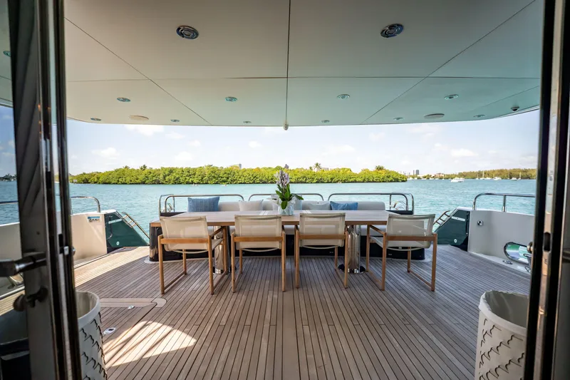 Slide: The Image of Luxurious Sunseeker 34 Metre Yacht 2011 with elegant outdoor dining area and scenic water view. - 23
