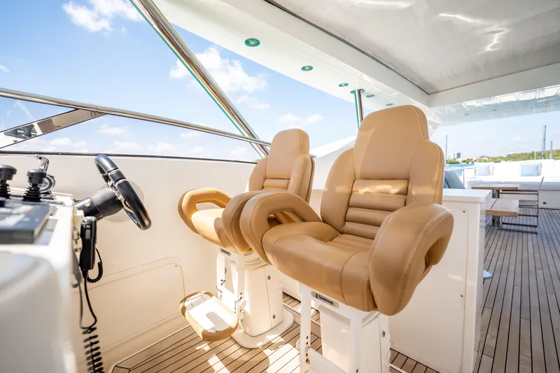 Slide: The Image of Luxurious helm seats on a 2011 Sunseeker 34 Metre Yacht, showcasing elegant design and comfort. - 24