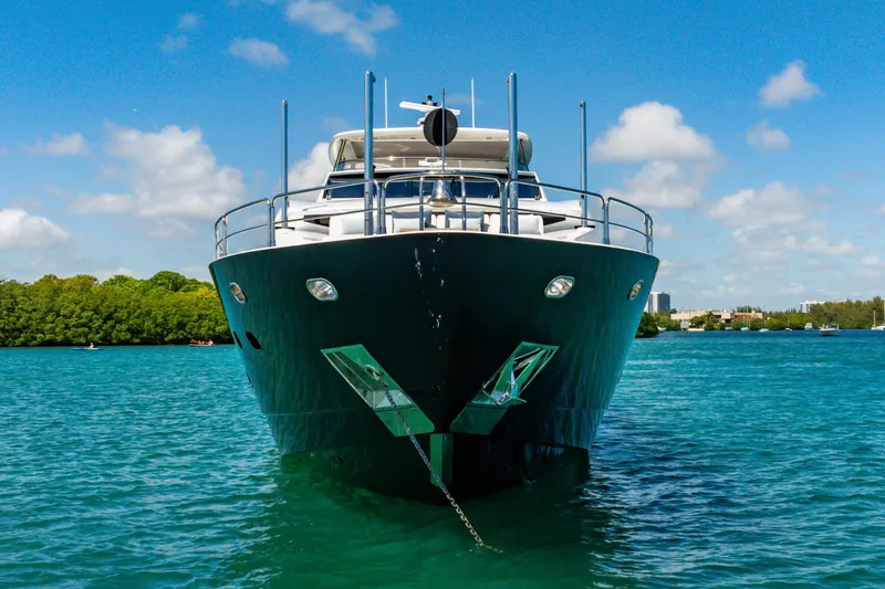 Slide: The Image of Front view of a 2011 Sunseeker 34 Metre Yacht on clear blue water. - 3