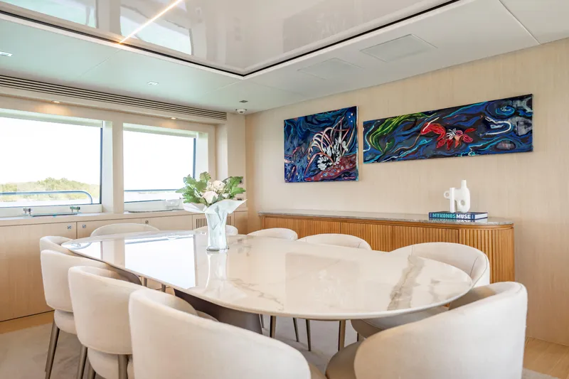 Slide: The Image of Luxurious dining area on 2011 Sunseeker 34 Metre Yacht with elegant decor and artwork. - 34