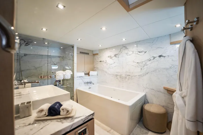 Slide: The Image of Luxurious marble bathroom on 2011 Sunseeker 34 Metre Yacht with bathtub and glass shower. - 51