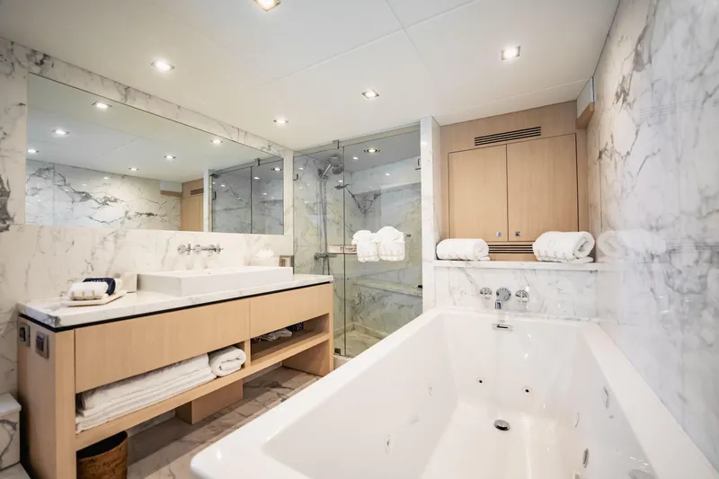Slide: The Image of Luxurious marble bathroom on 2011 Sunseeker 34 Metre Yacht with modern fixtures and spacious tub. - 53