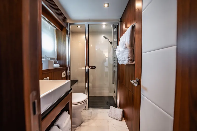Slide: The Image of Luxurious bathroom on 2011 Sunseeker 34 Metre Yacht with modern fixtures and elegant wood finishes. - 56