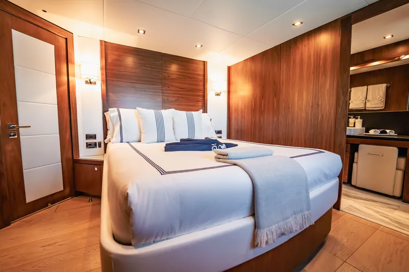 Slide: The Image of Luxurious bedroom interior on 2011 Sunseeker 34 Metre Yacht with elegant wood paneling. - 59