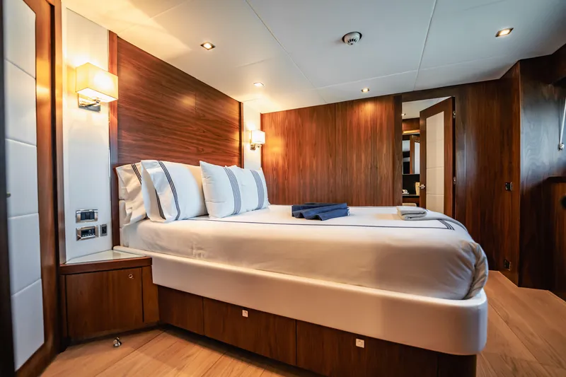 Slide: The Image of Luxurious bedroom interior on 2011 Sunseeker 34 Metre Yacht with elegant wood paneling. - 60