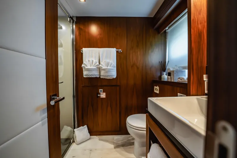 Slide: The Image of Luxurious bathroom on a 2011 Sunseeker 34 Metre Yacht with elegant wood paneling. - 64