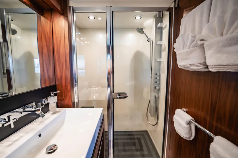 Slide: The Image of Luxurious bathroom on 2011 Sunseeker 34 Metre Yacht with modern shower and elegant wood finishes. - 70