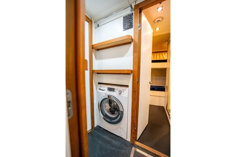 Slide: The Image of Laundry area with washing machine on 2011 Sunseeker 34 Metre Yacht. - 71
