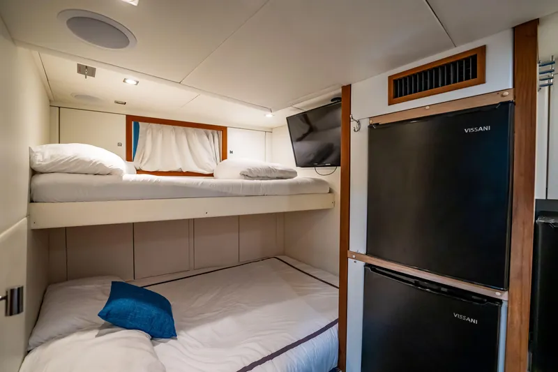 Slide: The Image of Cozy cabin interior of 2011 Sunseeker 34 Metre Yacht with bunk beds and mini-fridges. - 74