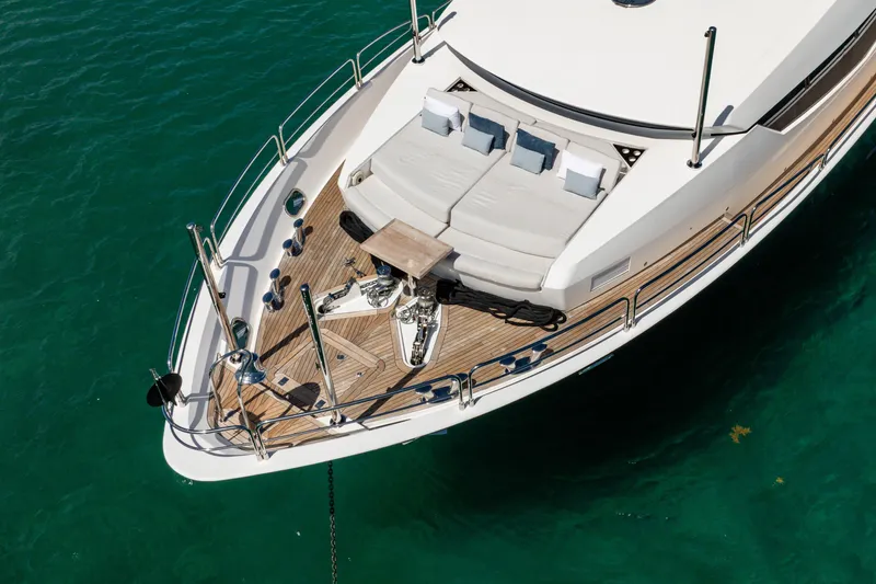 Slide: The Image of Sunseeker 34 Metre Yacht 2011, aerial view of deck and seating area on turquoise water. - 8