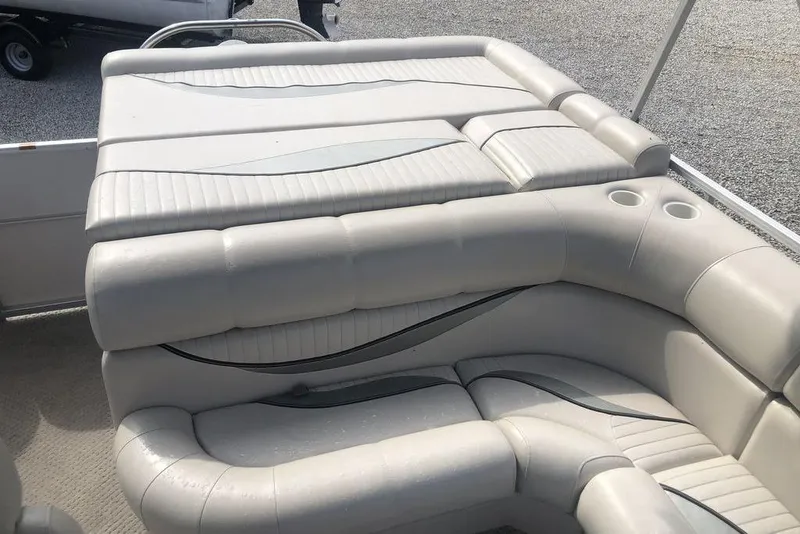 Slide: The Image of 2008 South Bay 822 CR Tritoon boat interior with cushioned seating and cup holders. - 6