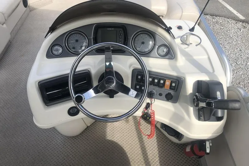 Slide: The Image of Steering console of 2008 South Bay 822 CR Tritoon with gauges and controls. - 8