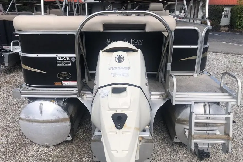Slide: The Image of 2008 South Bay 822 CR Tritoon with Evinrude 150 engine, rear view on gravel. - 9
