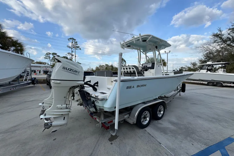 Slide: The Image of 2021 Sea Born LX24 Center Console boat with Suzuki outboard motor on trailer. - 11