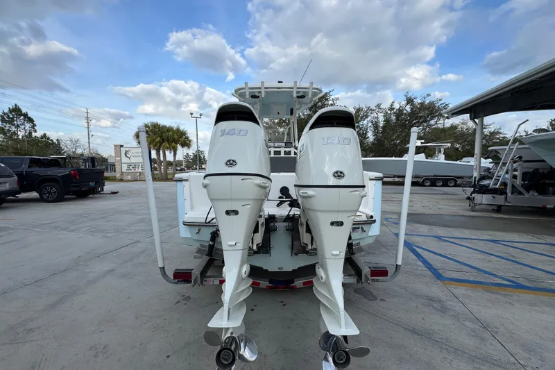 Slide: The Image of 2021 Sea Born LX24 Center Console boat with dual 140 horsepower outboard engines. - 13