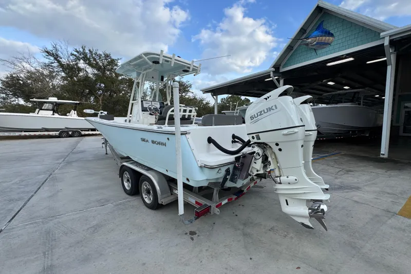 Slide: The Image of 2021 Sea Born LX24 Center Console boat with Suzuki outboard engines on a trailer. - 15