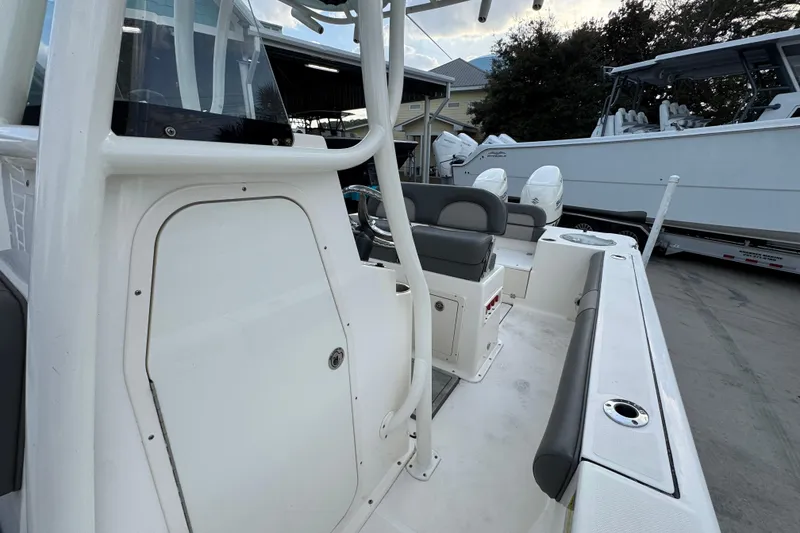 Slide: The Image of 2021 Sea Born LX24 Center Console boat interior with seating and storage. - 25