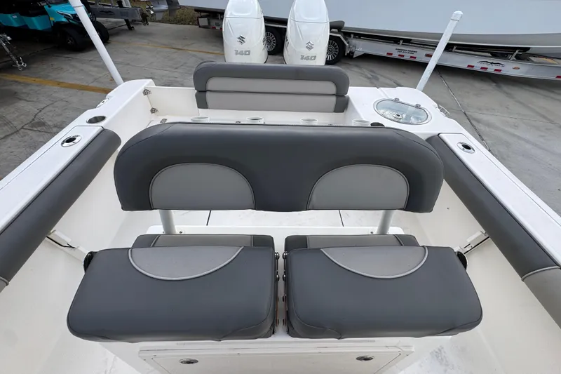 Slide: The Image of 2021 Sea Born LX24 Center Console boat interior with dual Suzuki 140 engines. - 26