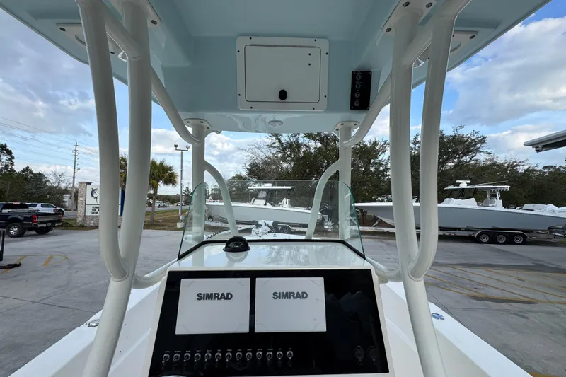 Slide: The Image of 2021 Sea Born LX24 Center Console boat interior with Simrad navigation system. - 32