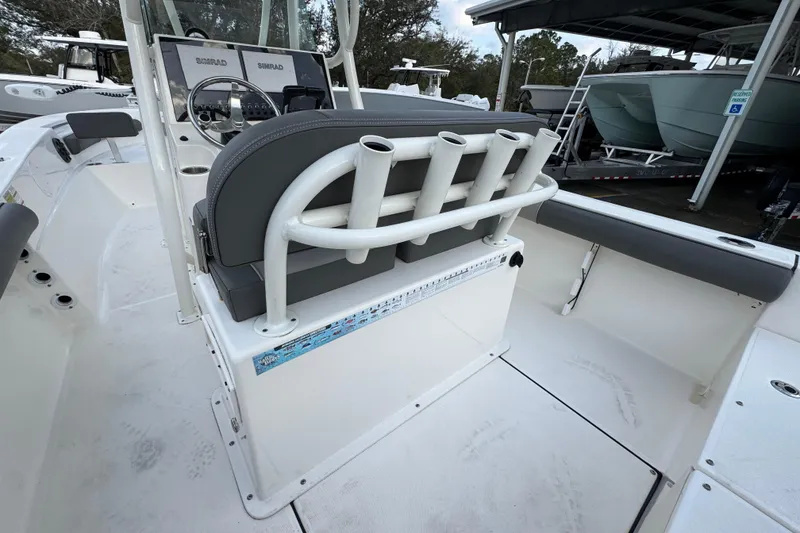 Slide: The Image of 2021 Sea Born LX24 Center Console boat interior with rod holders and steering console. - 35