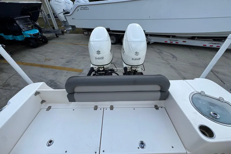 Slide: The Image of 2021 Sea Born LX24 Center Console with twin Suzuki 140 outboard engines. - 36