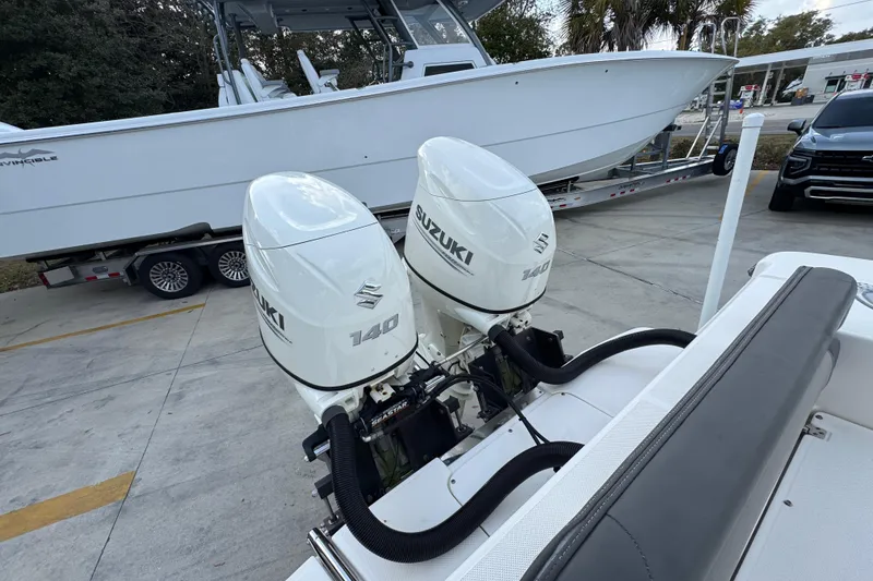 Slide: The Image of 2021 Sea Born LX24 Center Console with dual Suzuki 140 outboard motors. - 41