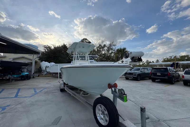 Slide: The Image of 2021 Sea Born LX24 Center Console boat on trailer in parking lot. - 6