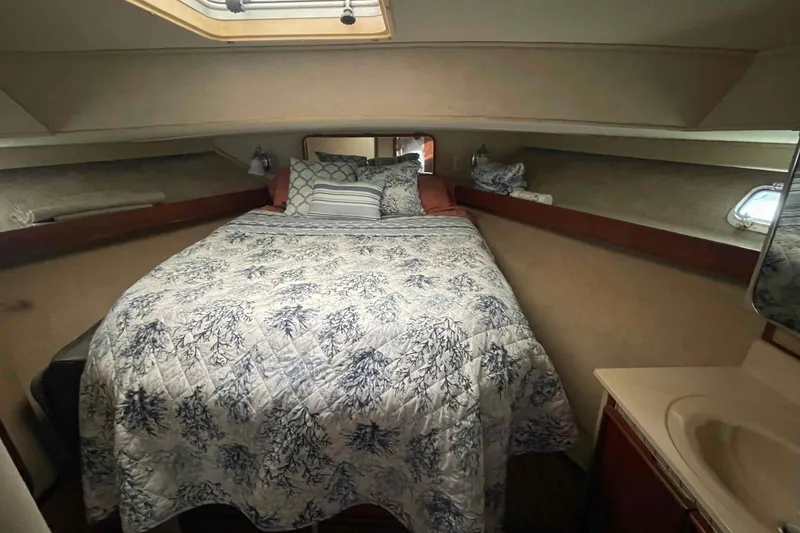 Slide: The Image of Cozy bedroom interior of 1987 Chris-Craft 426 Catalina yacht with tropical bedding. - 11