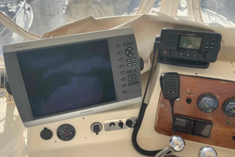 Slide: The Image of Engine compartment of 1987 Chris-Craft 426 Catalina, showing mechanical components and wiring. - 23