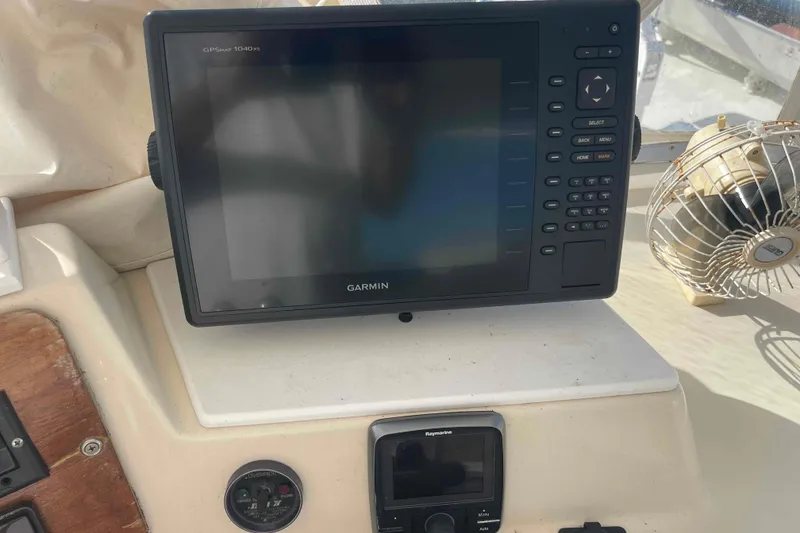 Slide: The Image of Engine compartment of a 1987 Chris-Craft 426 Catalina boat, showing mechanical components and wiring. - 24