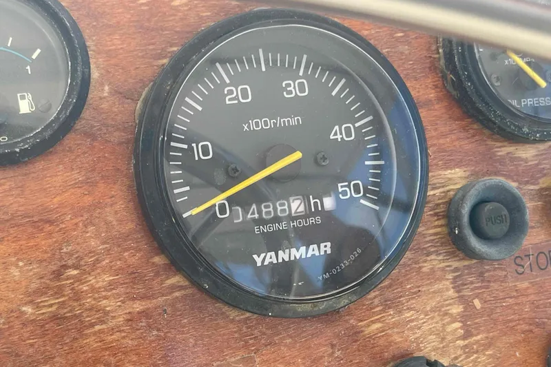 Slide: The Image of 1987 Chris-Craft 426 Catalina helm with dual Garmin displays, marina view. - 27