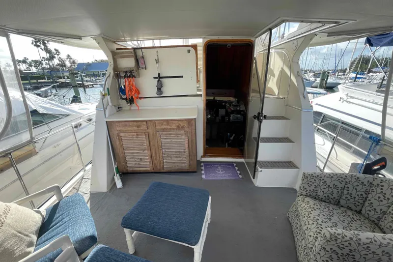 Slide: The Image of 1987 Chris-Craft 426 Catalina yacht interior with seating and marina view. - 3