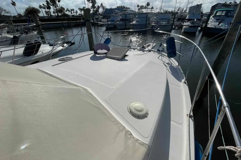 Slide: The Image of 1987 Chris-Craft 426 Catalina yacht deck view with water reflections. - 33