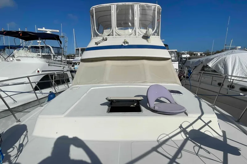 Slide: The Image of 1987 Chris-Craft 426 Catalina engine hours gauge showing 4841 hours, Yanmar branding visible. - 35