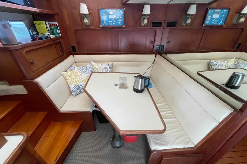 Slide: The Image of Interior of 1987 Chris-Craft 426 Catalina yacht with kitchen and seating area. - 7