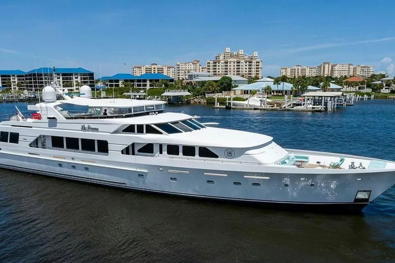 The Image of Luxurious 2000 Christensen Raised Pilothouse yacht docked in a scenic marina. - 0